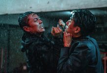 Two men fight in the rain in The Furious