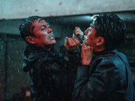 Two men fight in the rain in The Furious