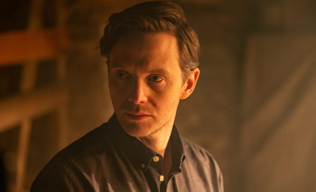 William (Mark O'Brien) looks concerned in Shudder's The Voices of Our Mother