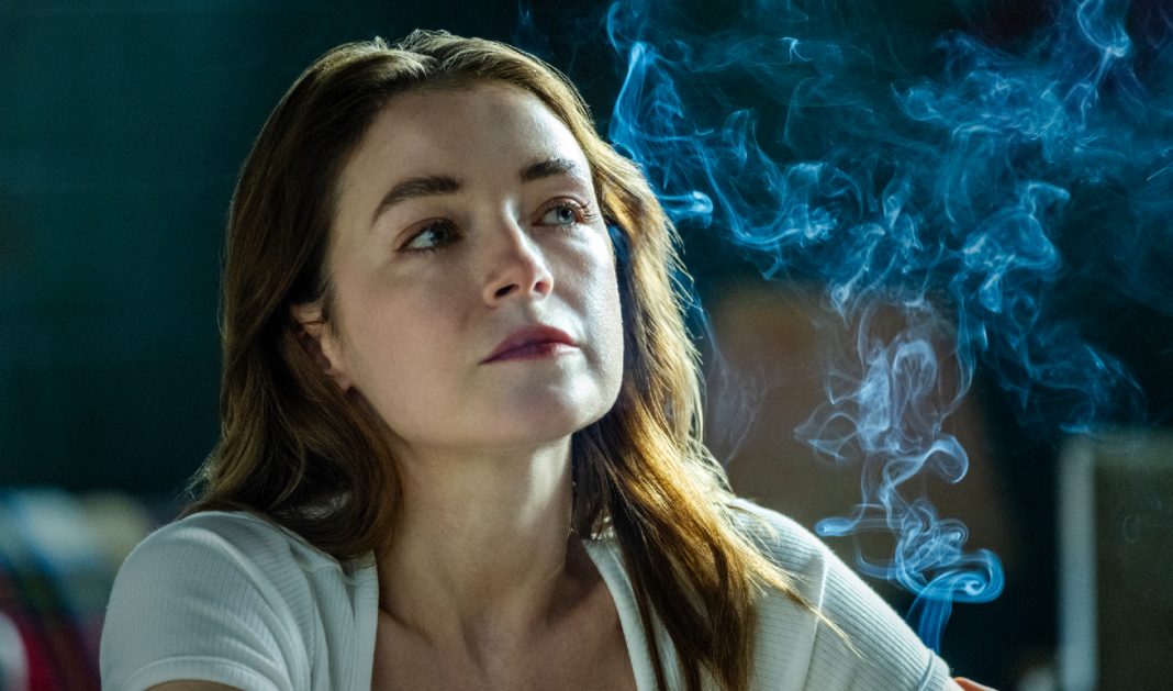 Bridget Walsh (Sarah Bolger) sits surrounded by smoke in The Westies Episode 4
