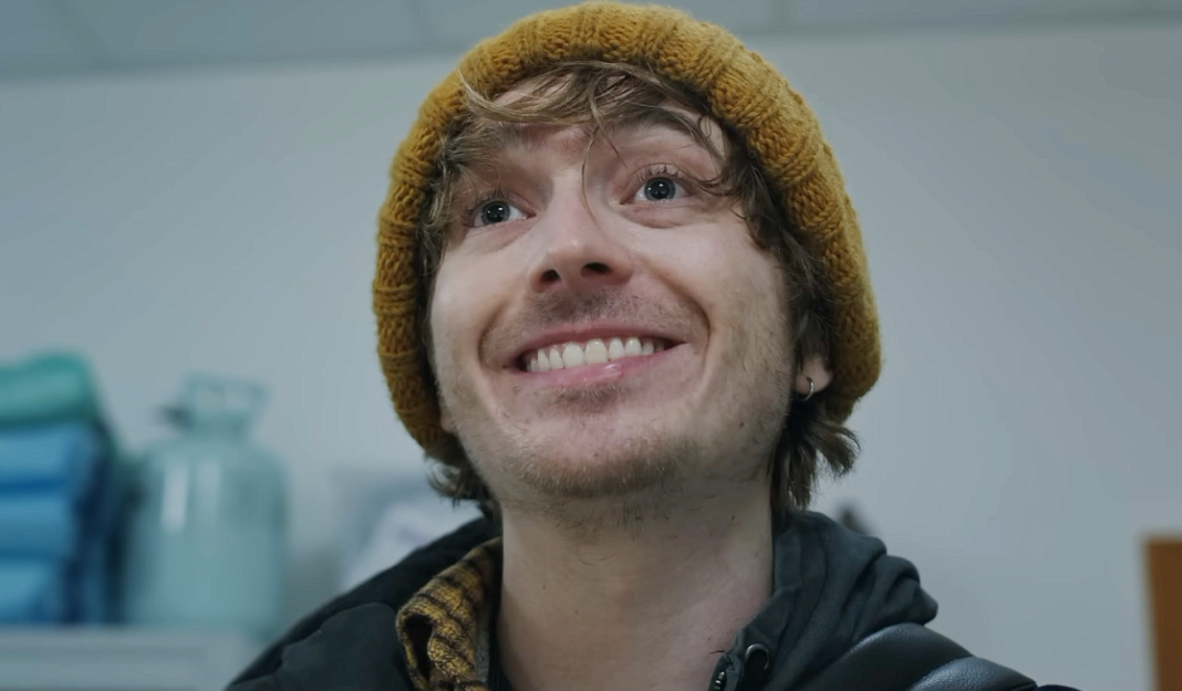 Bryan (Austin Abrams) smiles in the hospital in Resident Evil reboot