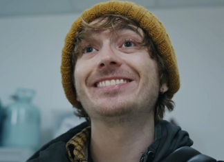 Bryan (Austin Abrams) smiles in the hospital in Resident Evil reboot
