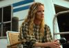 Crystal (Juliette Lewis) sits on the houseboat deck, fishing, in Cape Fear Episode 9