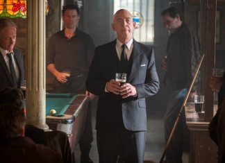 Eamon Sweeney (J.K. Simmons) gives a toast at a bar in The Westies Episode 4