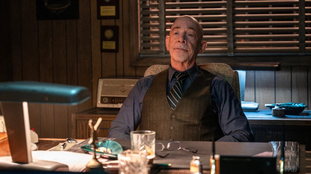 Eamon Sweeney (J.K. Simmons) sits at his desk in The Westies Episode 2