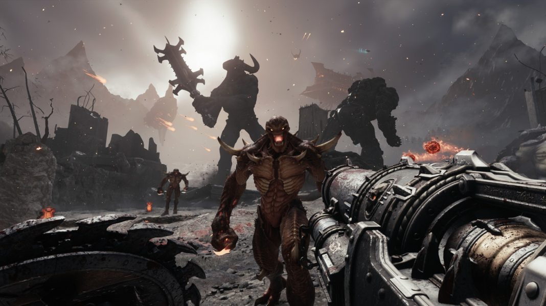 Facing down a colossal demon and imps in DOOM: The Dark Ages