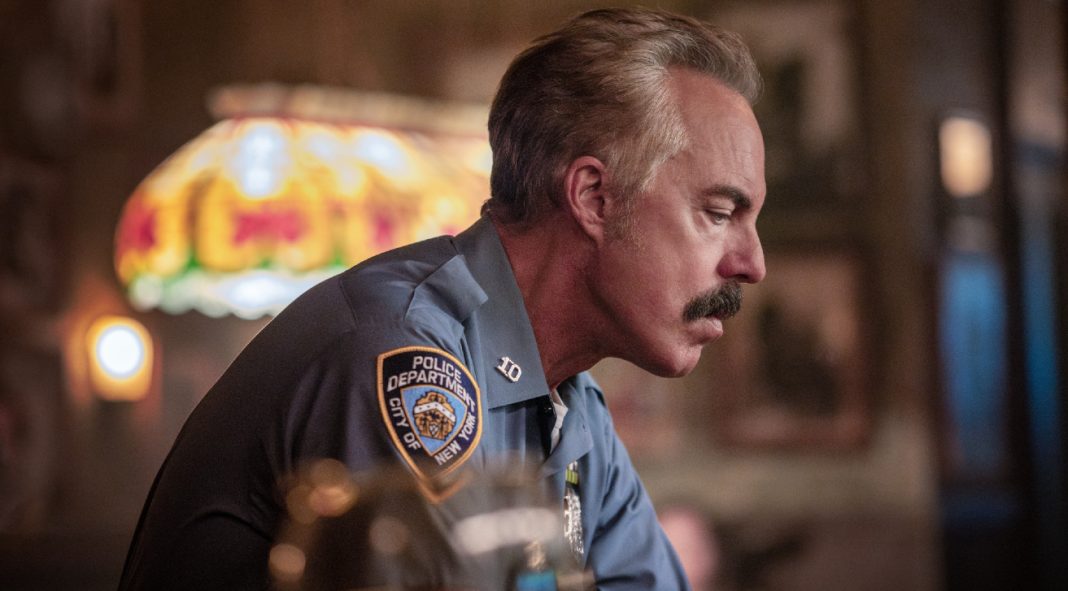 Officer Glenn Keenan (Titus Welliver) sits at a bar in thought in The Westies Episode 4