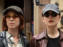 Bridget stands next to an associate in The Westies Episode 6