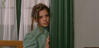 ‘Laurin’ Blu-ray Review: Visual Vengeance Gives the 1989 Gothic Thriller Its Due Laurin looks around a wall in Laurin