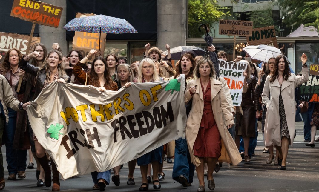 Protestors march in the streets in Hells Kitchen in The Westies Episode 6