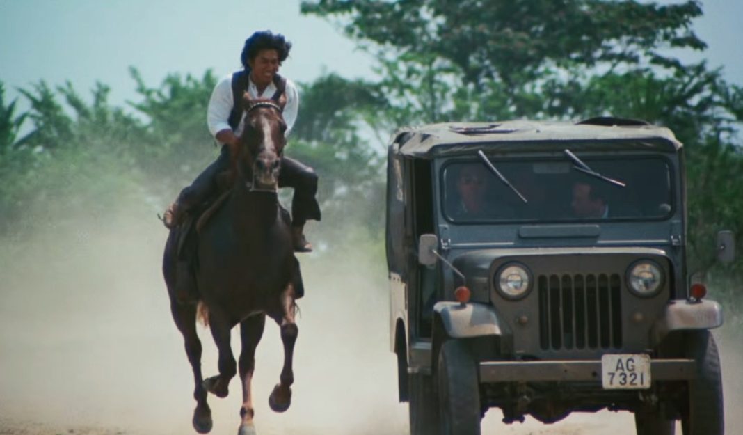 A man on horseback rides next to a Jeep in Roaring Fire 1981 A man on horseback rides next to a Jeep in Roaring Fire 1981