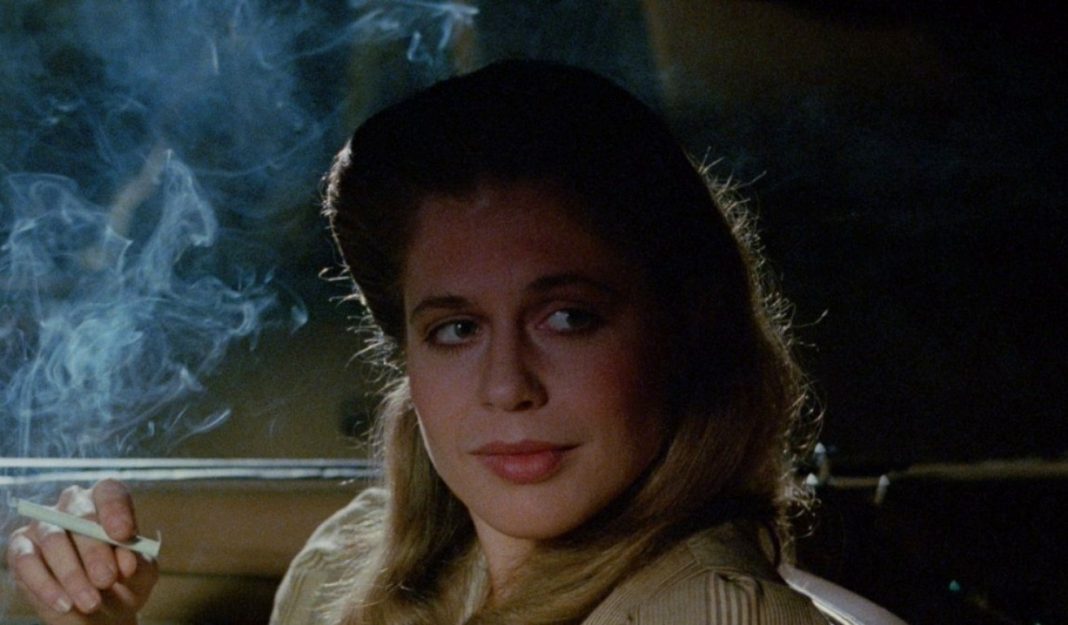 Linda Hamilton smokes while talking to someone in a car in TAG The Assassination Game Linda Hamilton smokes while talking to someone in a car in TAG The Assassination Game
