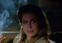 Linda Hamilton smokes while talking to someone in a car in TAG The Assassination Game