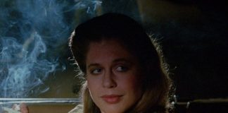 Linda Hamilton smokes while talking to someone in a car in TAG The Assassination Game