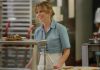 Pam Voorhees (Linda Cardellini) stands behind a diner counter in Crystal Lake
