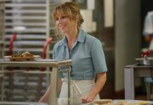 Pam Voorhees (Linda Cardellini) stands behind a diner counter in Crystal Lake