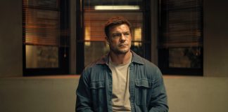 ‘Reacher’ Season 4, Episode 8 Recap & Review: An Action-Packed Finale Makes Up for a Slow Start Reacher sits at a police desk in Reacher Season 4