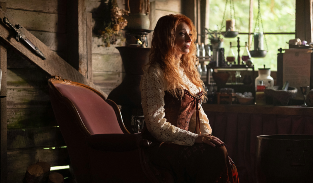 Cassandra Peterson sits in a cottage in R.L. Stine’s Pumpkinhead 2